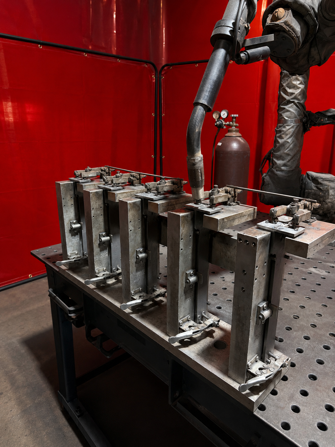 Robotic welding torch operating over a production fixture